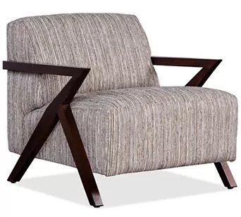 Modern armchair with wooden frame design.